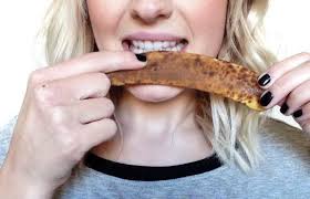 Rubbing the inside of a banana peel on your teeth is one of the many natural teeth whitening remedies.